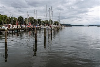 Lauterbach, Germany, August 1, 2019: View of the port with sailing boats moored on docks, Europe