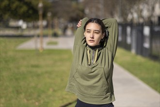 Young woman doing stretching exercise