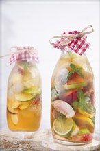 Bottle of infused fruit tea with peach and lemon