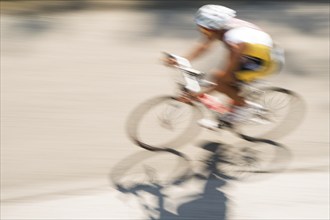 Cycling race with representation runner with blur