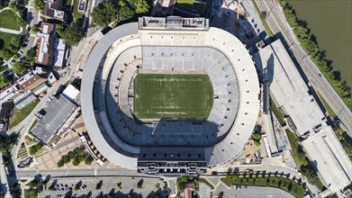 An aerial view of Neyland Stadium reveals a massive, iconic structure nestled by the Tennessee