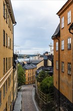 Picturesque street with colorful houses in Ugglan quarter in Sodermalm, Stockholm, Sweden, Europe