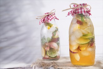 Bottle of infused fruit tea with peach and lemon