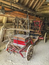 Historic fire engine for horse-drawn carriage from the early 20th century with turntable ladder,