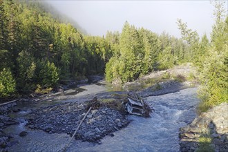 Wreckage of a car lying in a creek, Richardson Highway, Alaska, USA, North America