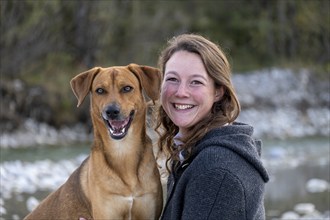 Laughing animal, young woman with her dog, intimate relationship, love of animals, Upper Bavaria,