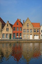 Typical Belgian cityscape Europe tourism concept, canal and old houses on sunset. Bruges (Brugge),