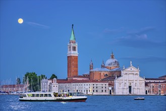 Basilica San Giorgio Maggiore Church with vaporetto waterbus seen across the Venice lagoon with