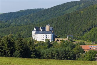 Scharfenstein Castle Scharfenstein Castle is located on an elongated mountain spur above the