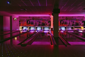 Colourfully illuminated bowling alley, bowling centre, interior, Germany, Europe