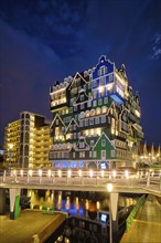 ZAANDAM, NETHERLANDS, MAY 21, 2018: Inntel Hotel in Zaandam illuminated at night. Design of