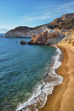 Agios Ioannis greek beach and Aegean sea on sunset. Milos island, Greece, Europe