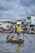 CAN THO, VIETNAM, 4 JUNE, 2011: Unidentified people at floating market in Mekong river delta. Cai