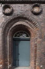 Front door and coat of arms of the house of the members of the Schutztruppe of the Lüneburg