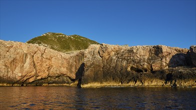 Evening light, Boat tour, View from the sea, Bizarre rock formations, Rugged mountains, Marettimo,