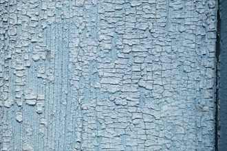 Abstract wooden background. Cracked paint on the wall