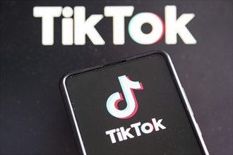 TikTok logo social media on a mobile phone and computer screen