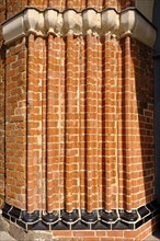 Fascia of a church portal with archivolts from the brick Gothic period, using the example of the