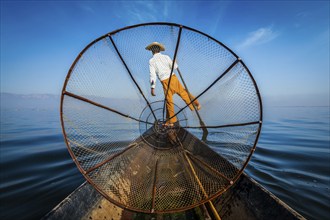 Myanmar travel attraction landmark, Traditional Burmese fisherman with fishing net at Inle lake in