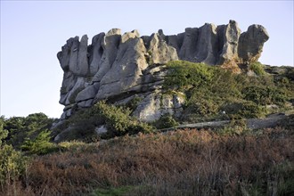 Eroded rock formation La Couronne along the Côte de granit rose, Pink Granite Coast at Trégastel,