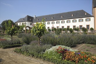 Convent building with garden from the monastery complex, Seligenstadt, Main, Hesse, Germany, Europe