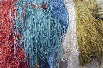 Colourful carpet yarns in a carpet factory, Turkey, Asia