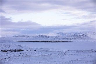 Snow-covered extinct volcano Hverfjall at blue hour, near Lake Myvatn, Northern Ireland Eyestra,