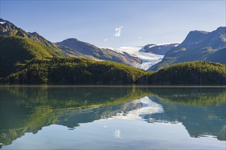 Glacier tongue of the Svartisen glacier reflected in glacial lake, Helgeland coast, Nordland,