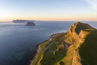 Coast and mountains in the evening light, runway of the abandoned airport, Værøy island, Vaeroy,