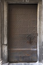 Iron door with door knocker at Palazzo Pinelli Parodi in the historic centre, Piazza Pinelli no. 2,