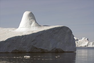 Giant iceberg with knob in the light of the midnight sun Disko Bay, Ilulissat, Arctic, Greenland,