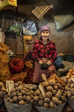 Vendor selling potatoes, stall, Osh Bazaar, Bishkek, Kyrgyzstan, Asia