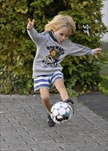 Boy, blond, 5 years, plays football, kicks, Stuttgart, Baden-Württemberg, Germany, Europe