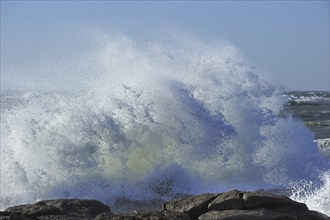 Waves crashing onto rocks along the Normandy coast, France, Europe