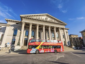 Bus for city tour in front of the National Theatre at Max-Joseph-Platz, Bavarian State Opera,