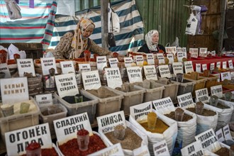 Two woman selling various spices at a stall, Osh Bazaar, Bishkek, Kyrgyzstan, Asia