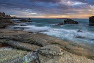 Rocky coast with cloudy sky, sunset, Utakleiv, Lofoten, Norway, Europe