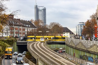 Motorway A40, Ruhrschnellweg, skyline of the city centre of Essen, exit Essen-Huttrop, track bus