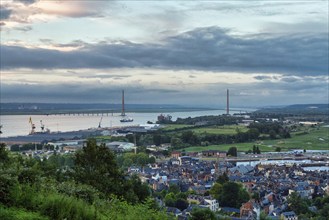 Panoramic view of the houses of the old town and the Seine with the Pont de Normandie cable-stayed