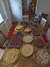 Cake buffet on a dining table, Lower Saxony, Germany, Europe