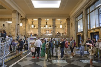 Visitors, queue of people in the foyer, Palace of Culture, Palac Kultury i Nauki, Warsaw,