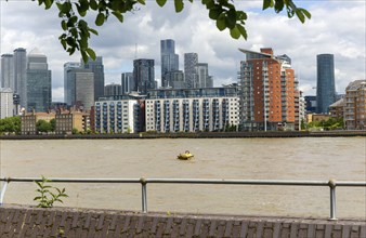 View from Deptford of River Thames and high rise offices of Canary Wharf, London, England, UK