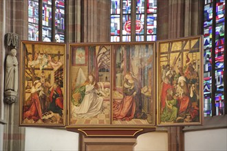 Historic folding altar with painting of Madonna figure, angel and birth of Jesus in the Gothic Lady