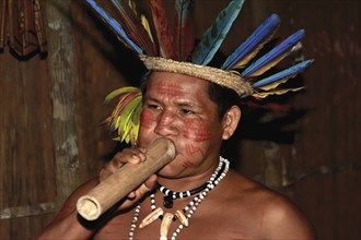 Portrait of an Indian man from the Dessanos tribe with face paintings and wearing a traditional hat