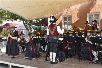 The Civic Band of Sterzing in typical South Tyrolean traditional costume at a brass band concert in