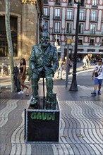 Street performer, mime, living statue of Antoni Gaudi, pedestrian in the city centre, Barcelona,