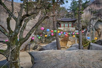 SEORAKSAN, SOUTH KOREA, APRIL 14, 2017: Kyejoam Seokgul Hermitage shrine and Ulsanbawi rock in