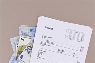 Gas bill document with euro bills