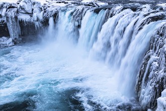 Godafoss waterfall, icy and snowy rock face, Northern Iceland Eyestra, Iceland, Europe