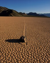 Stone on dried-out earth, Racetrack Valley, Death Valley, California, USA, North America